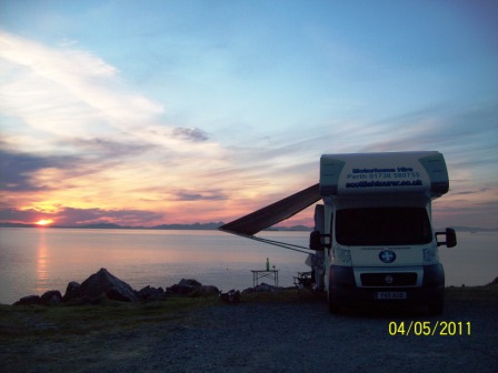 Scottish tourer motorhome in a sunset