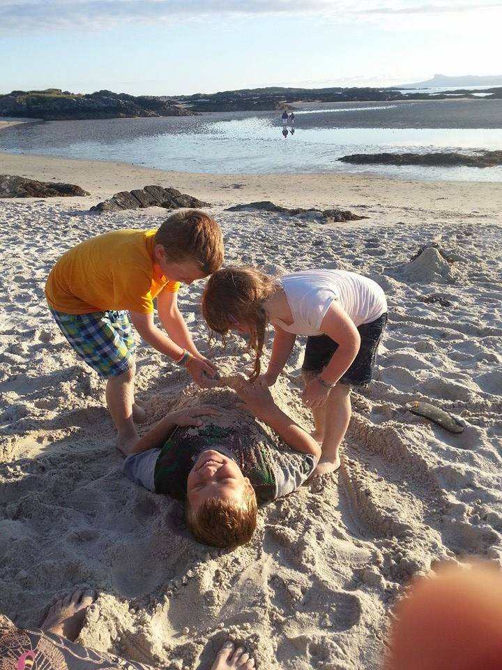 children playing on the beach