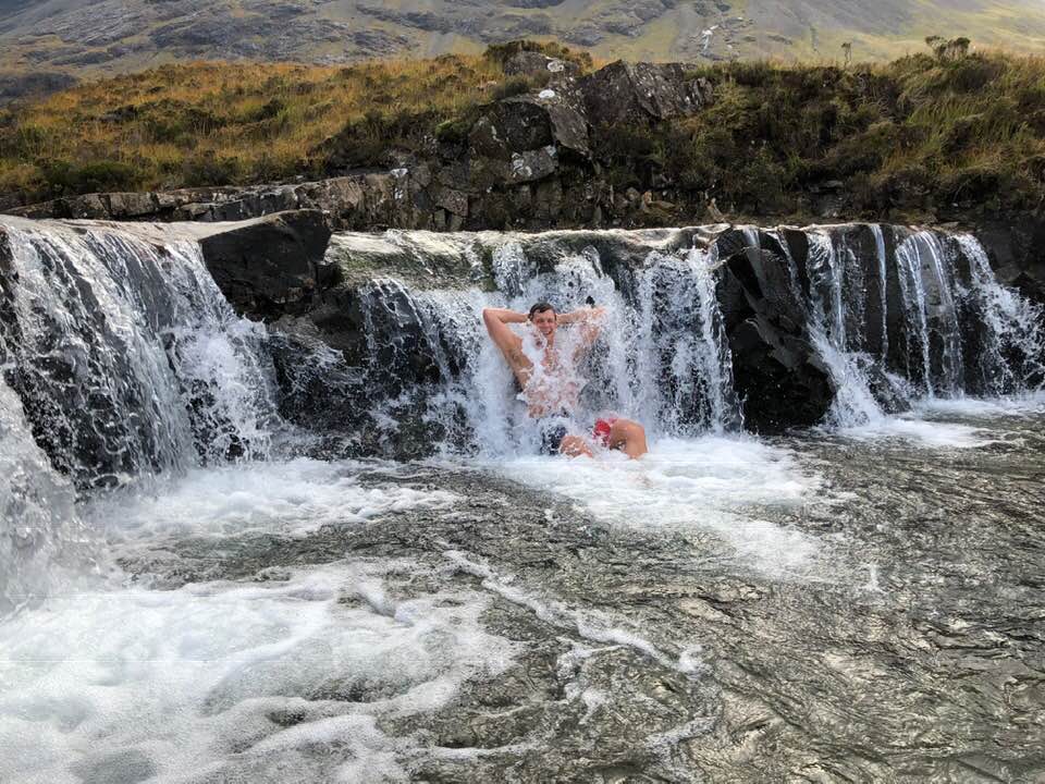 Scottish Tourer Customer enjoying a dip at fairy pools Isle of Skye