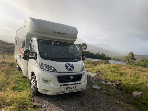 Scottish tourer campervan in the nature during a campervan holiday in Scotland