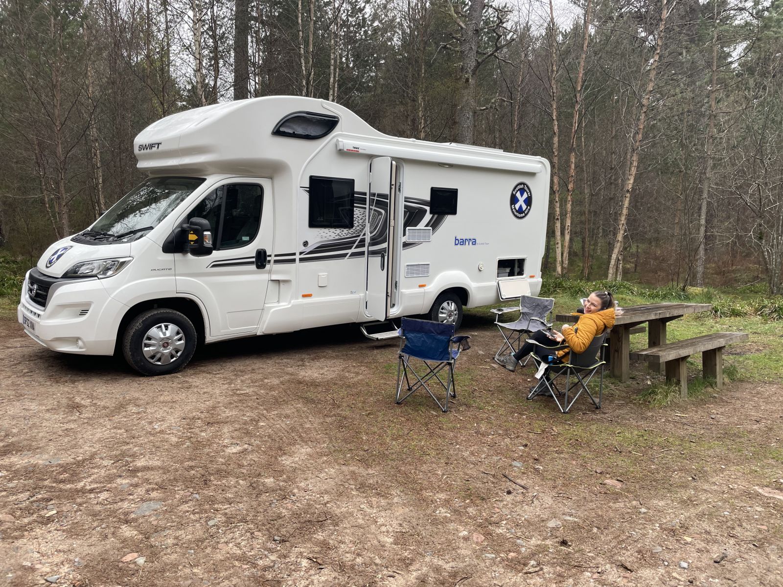 Motorhome parked in forest