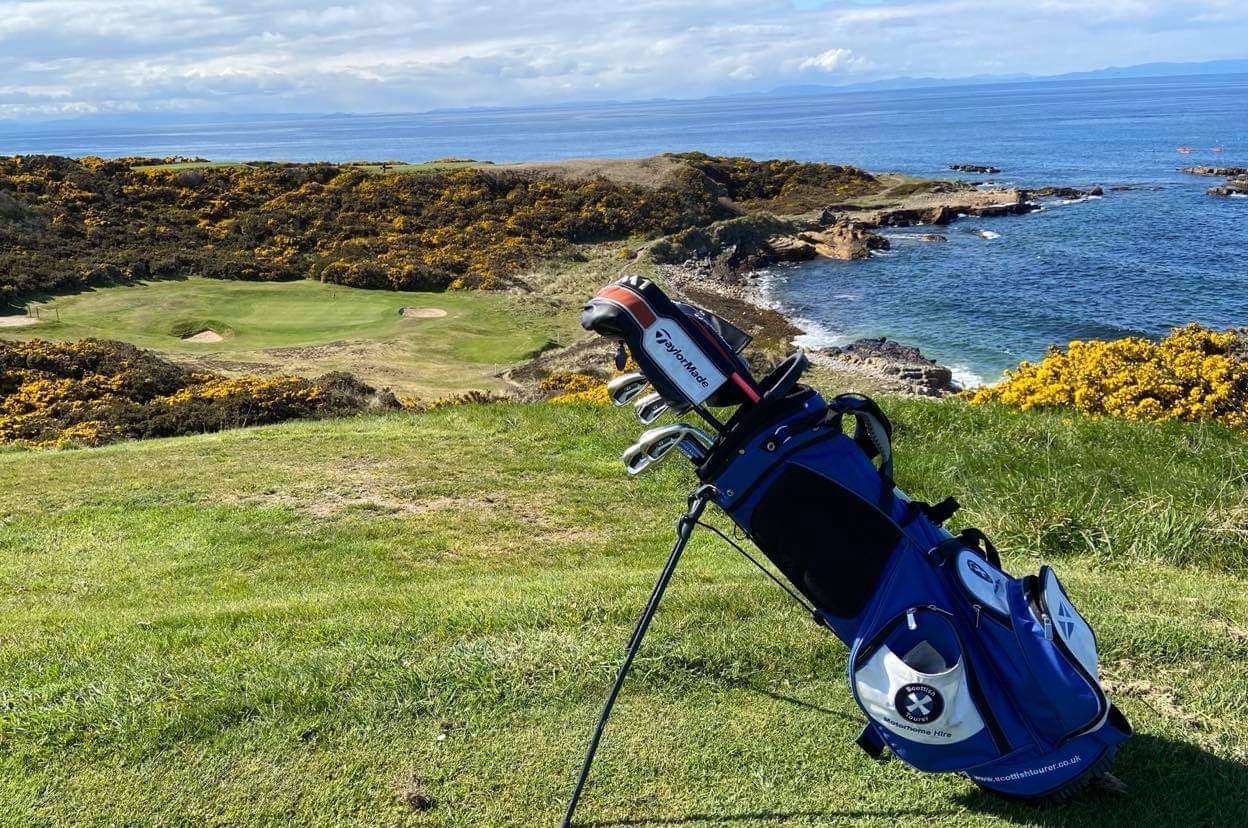 golf clubs on coastal course in Scotland