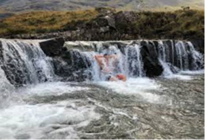 Customer enjoying a dip at the fairy pools