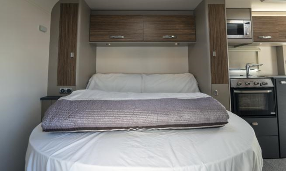 picture of the rear fixed bed in a Scottish tourer motorhome