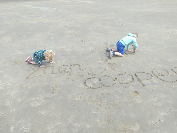 Children playing on the beach in the sand