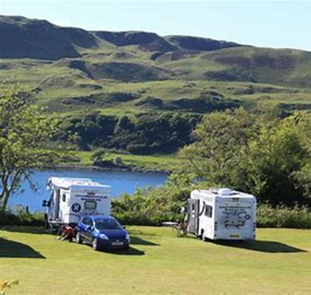 Motorhome parked by loch 