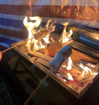 Toasting marshmallow on the bbq